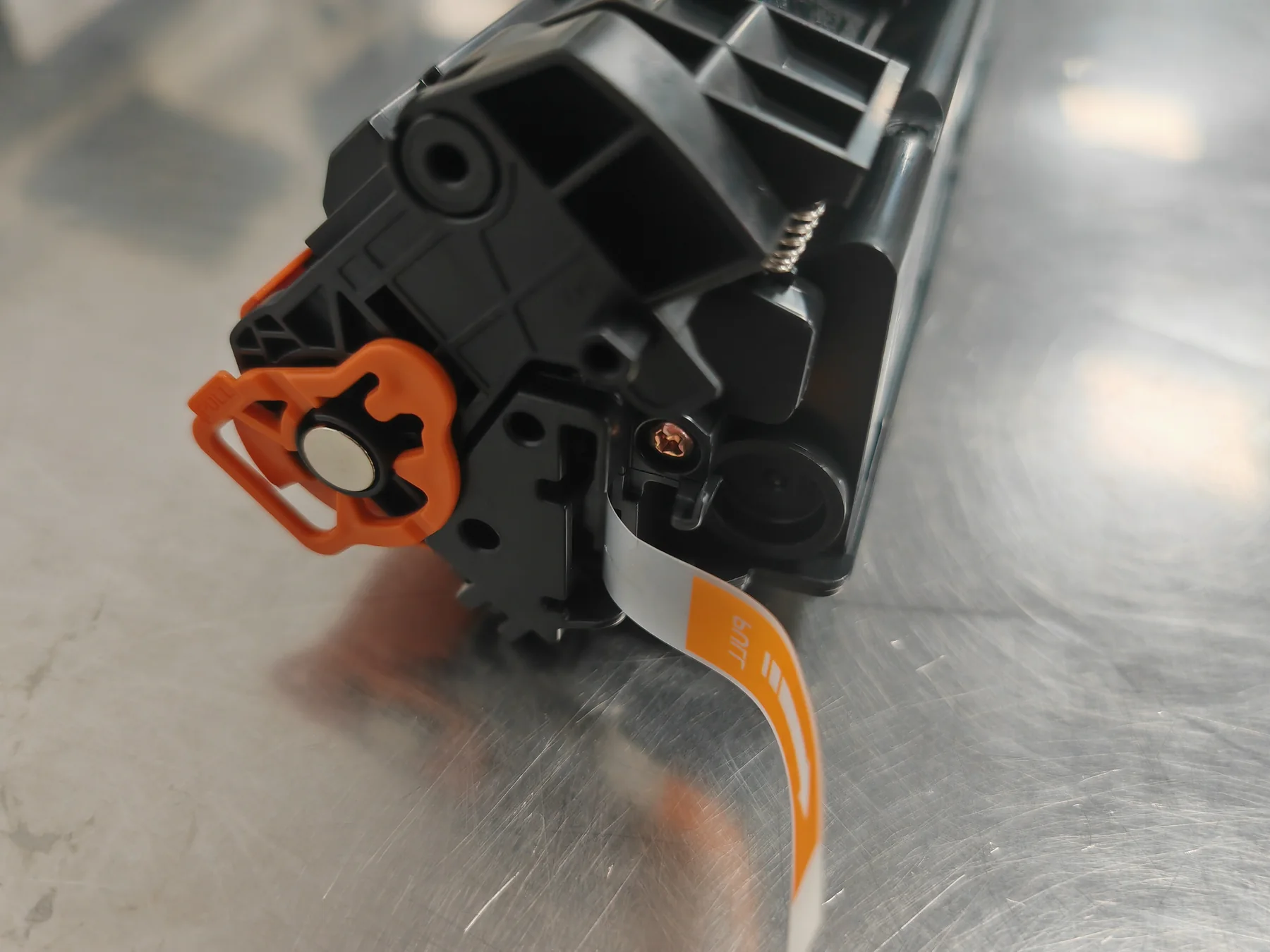 Real side-detail photo of an HP W1500A compatible toner cartridge sample